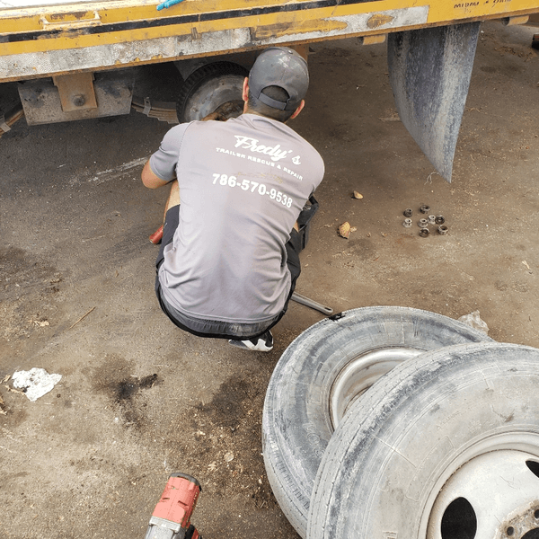 Dade Trailer Rescue And Repairs technician servicing trailer tires in Cutler Bay